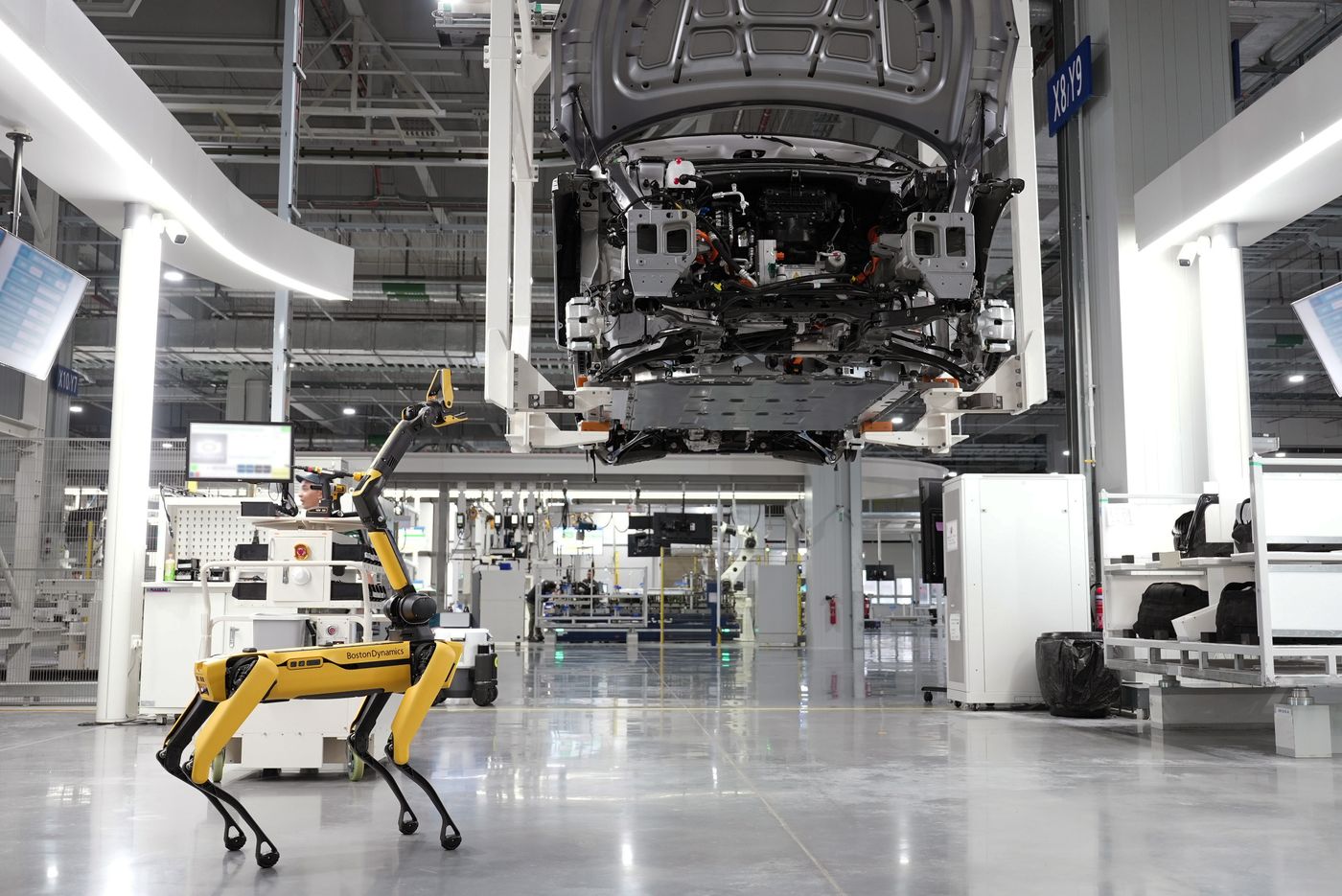 A mobile robot in a modern EV factory