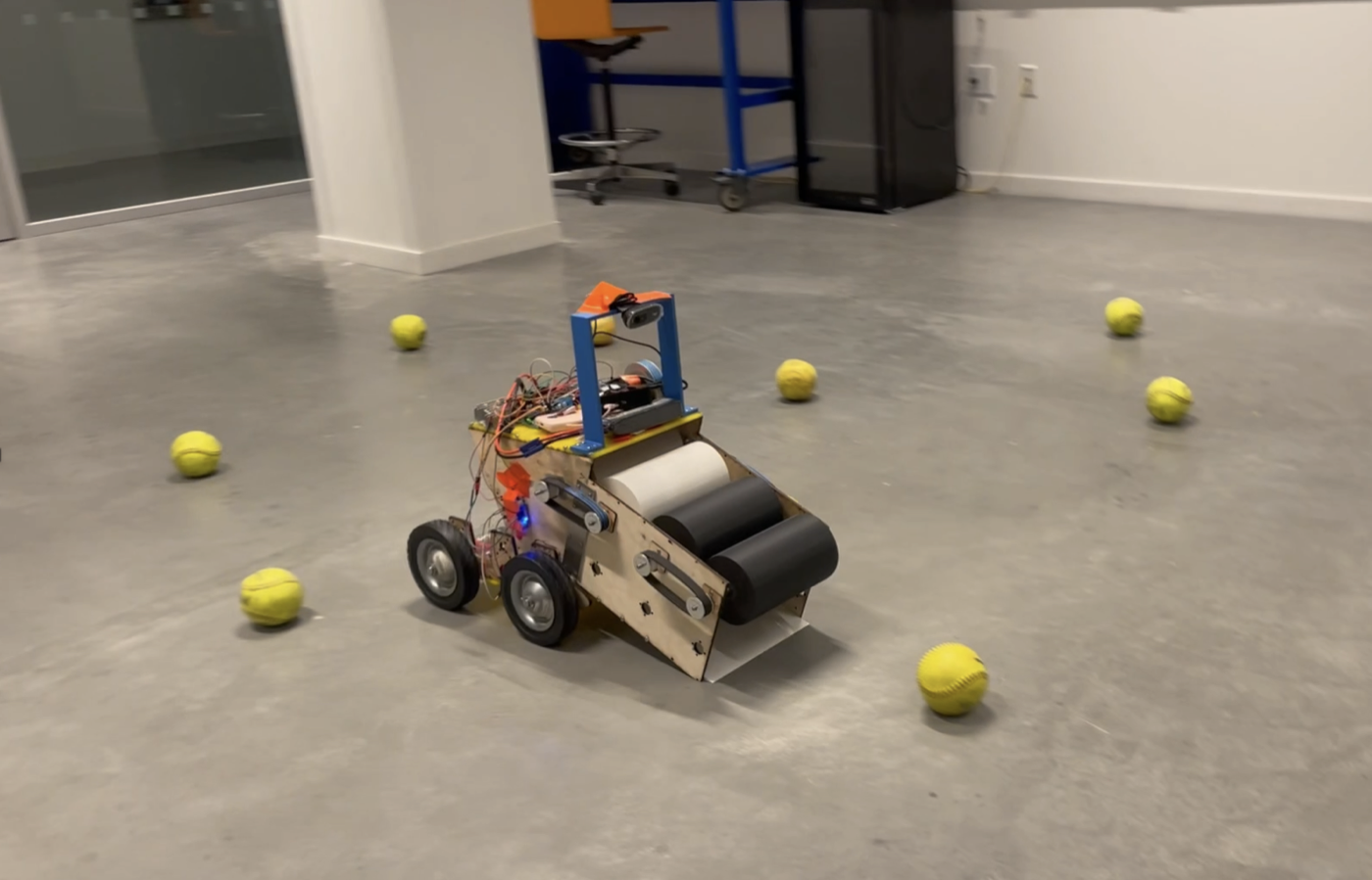 Softbot autonomously collecting softballs scattered across the lab floor